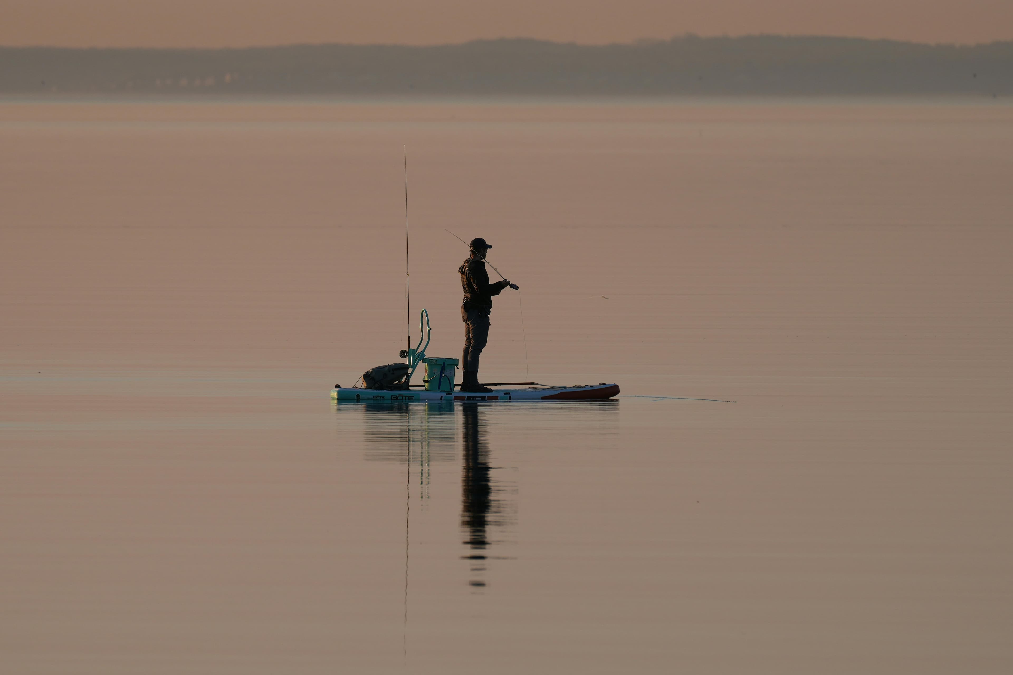 Fishing at dawn on a kayak
